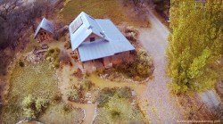 straw bale solar-powered home as seen from a camera drone.